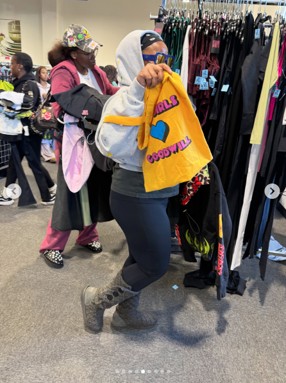 Women holding a yellow bag